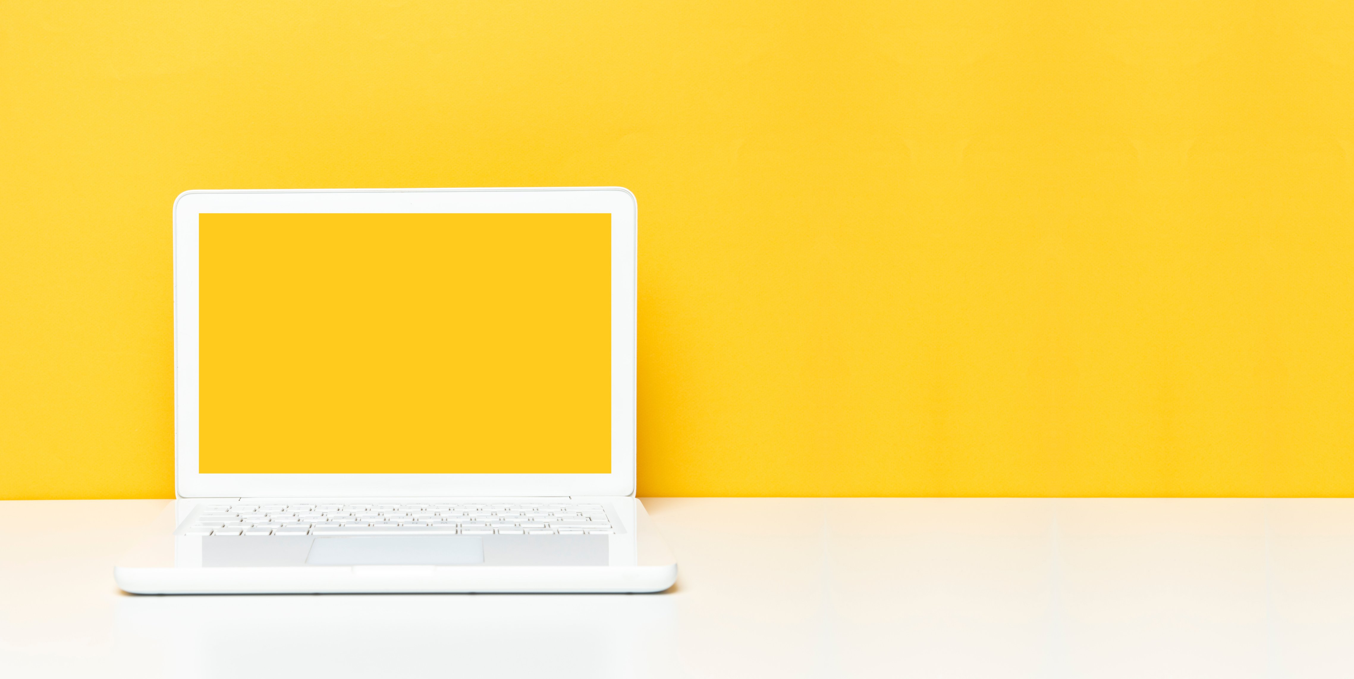 Yellow Screen Laptop On The Office Desk